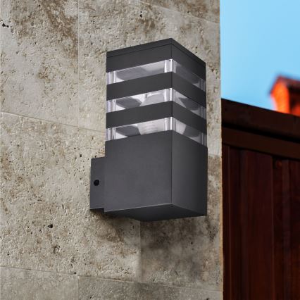 Aplique de pared exterior LED RGBW regulable TEKSAS 1xE27/9W/230V 2700-6500K Wi-Fi IP44 antracita