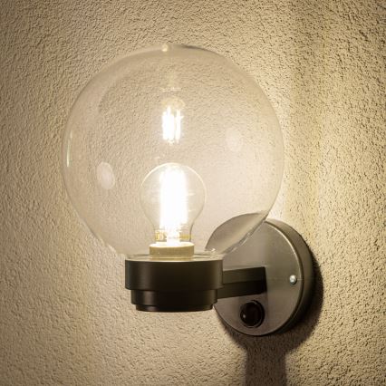 BRILAGI - Aplique de pared exterior con sensor de movimiento HARBOR 1xE27/40W/230V IP33 antracita/transparente