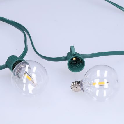 Brilagi - Guirnalda decorativa LED para exterior GIRLANDA 25xE12/0,8W/230V 20m verde IP44 blanco cálido