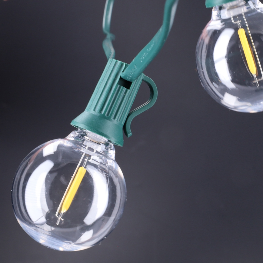 Brilagi - Guirnalda decorativa LED para exterior GIRLANDA 25xE12/0,8W/230V 20m verde IP44 blanco cálido