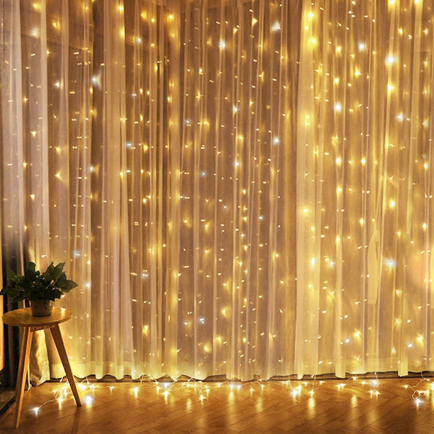 Brilagi - Cortina LED de Navidad 300 LEDs/8 funciones/3 pilas AA/USB 1,2 m blanco cálido