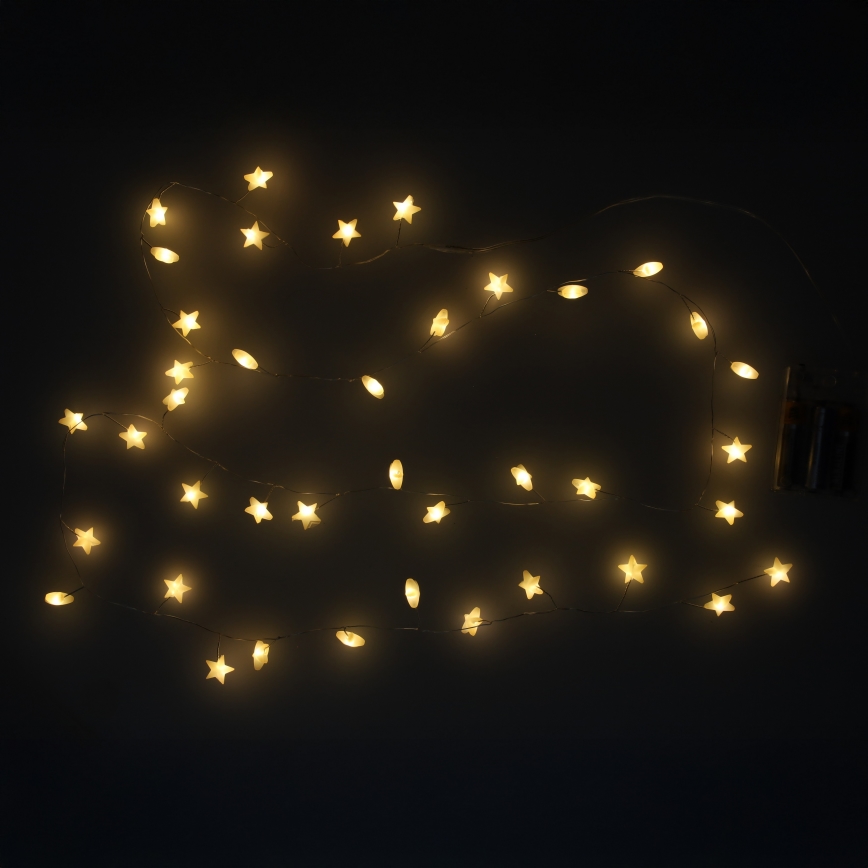 BRILAGI - Guirnalda de Navidad LED 40 LEDs / 3 pilas AA, 1,8 m, blanco cálido, con estrellas