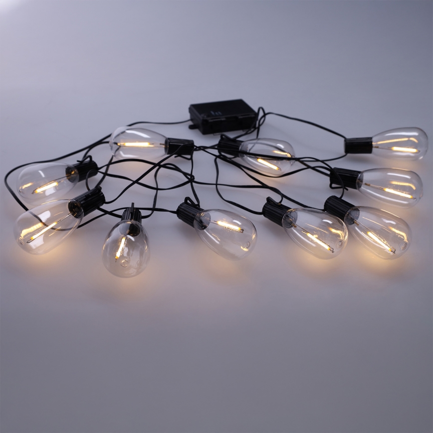 Brilagi - Guirnalda LED para exteriores, 10 LEDs / 3x AA, 3,2 m, IP44, blanco cálido