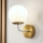 Brilagi - Lámpara de pared MALIVA 1xE14/15W/230V dorada/blanca