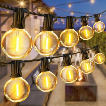 Guirnalda decorativa LED regulable para exterior, 25 x casquillo E12/1 W/24/230 V, 17,5 m, IP65, negra + mando a distancia