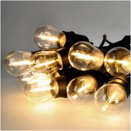 Cadena decorativa LED para exteriores BAJA ST64 20xE27/1W/230V 10,9m IP44 blanco cálido