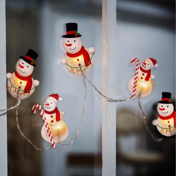 Guirnalda LED con ventosas, 6xLED/2xAA, 1,2 m, blanco cálido — muñeco de nieve
