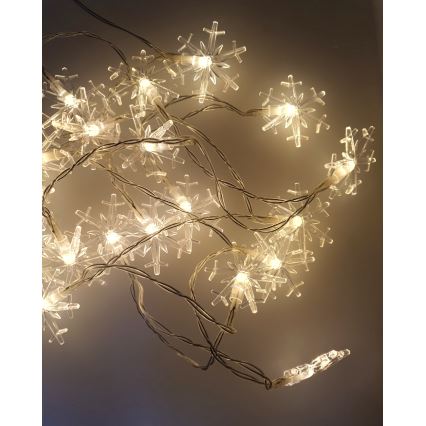 Guirnalda LED para exterior, 20xLED/2xAA, 2,2 m, IP44, blanco cálido, copos de nieve
