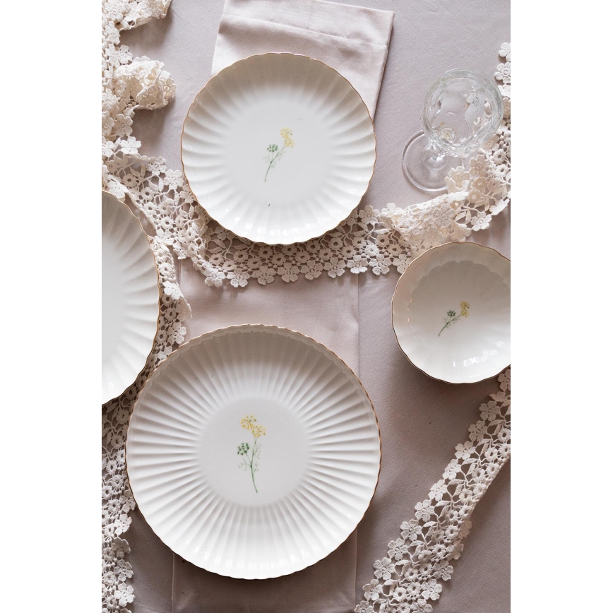 Juego de vajilla de 27 piezas en porcelana blanca con detalles dorados